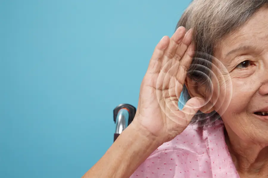 Front view old woman experiencing hearing issues